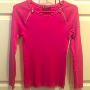 Long sleeve pink blouse.